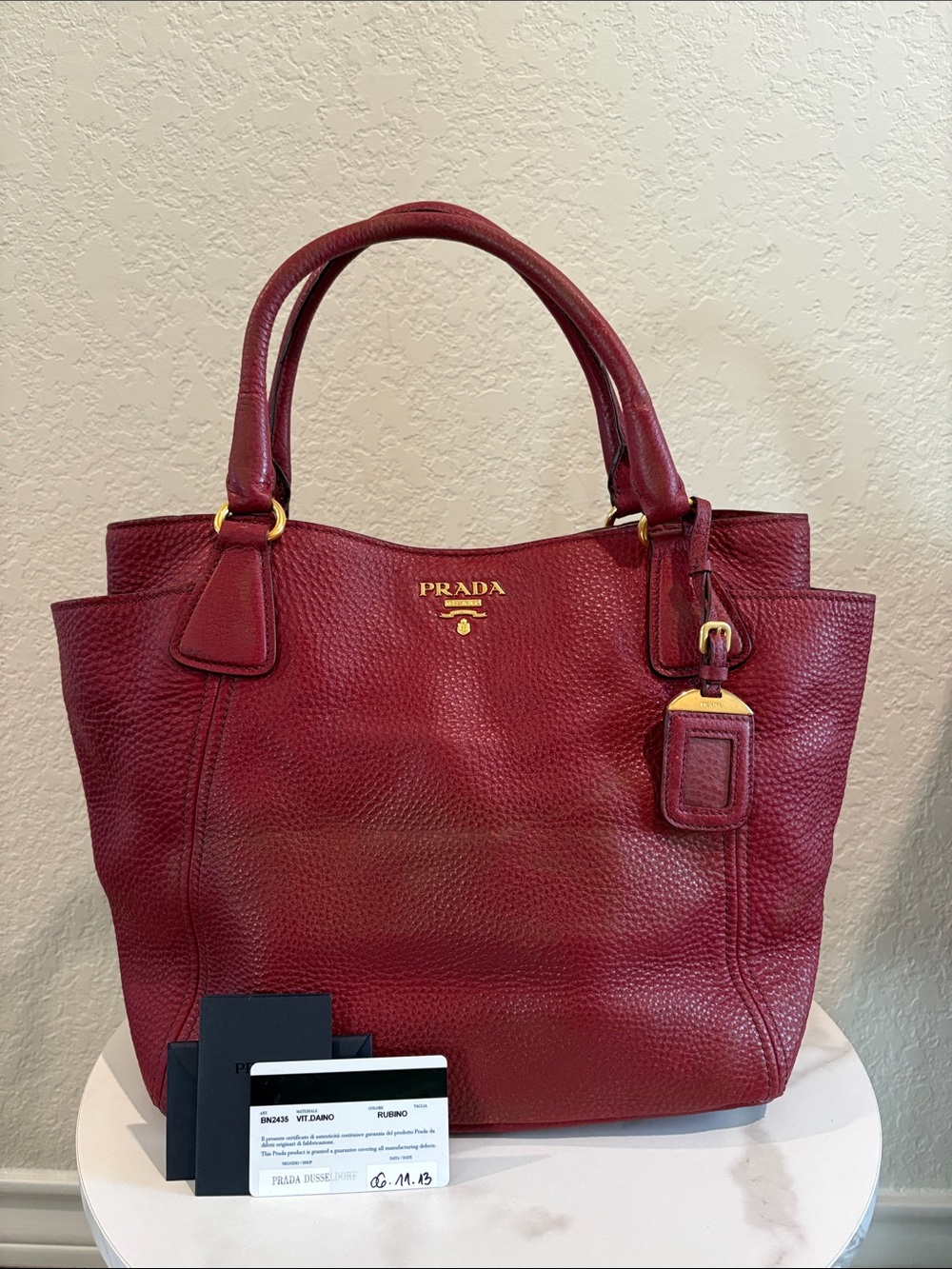 Prada Rubino Pebbled Leather Tote with Gold authenticity